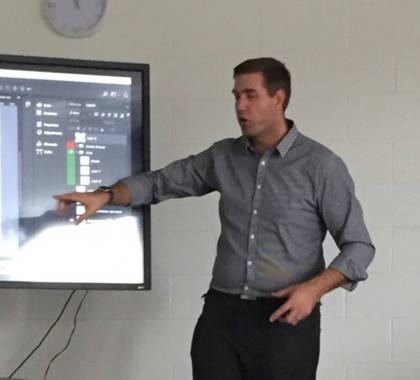Dave presenting a workshop in front of a screen